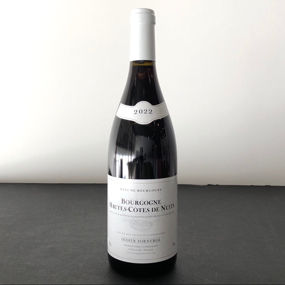 A bottle of 2022 Domaine Didier Fornerol Bourgogne Hautes Cotes de Nuits wine on a dark background.